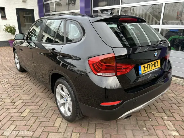 BMW X1 sDrive18i * AUTOMAAT * NAVIGATIE * AIRCO * 2013 Benzine 4